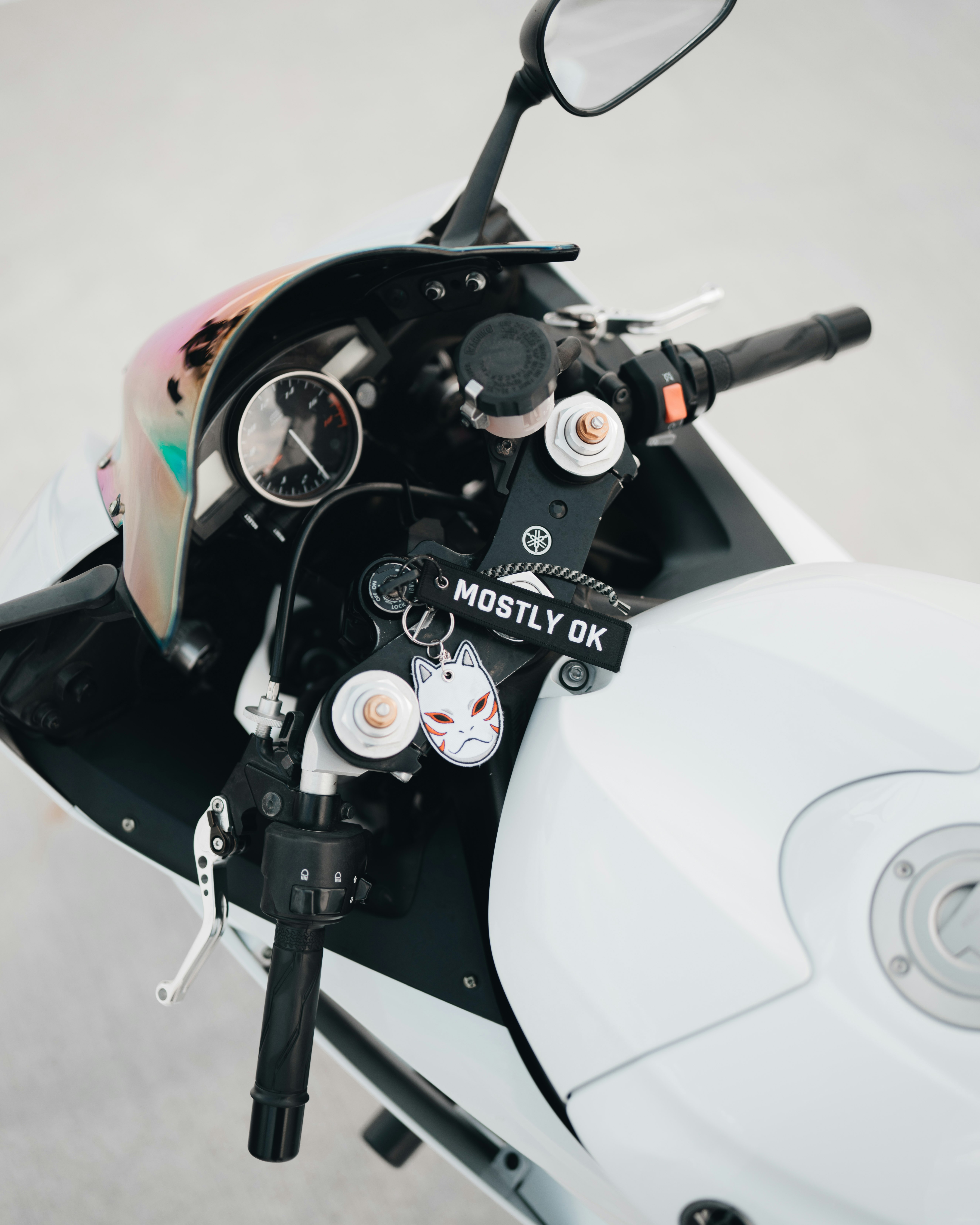 white and black motorcycle with black and gray motorcycle